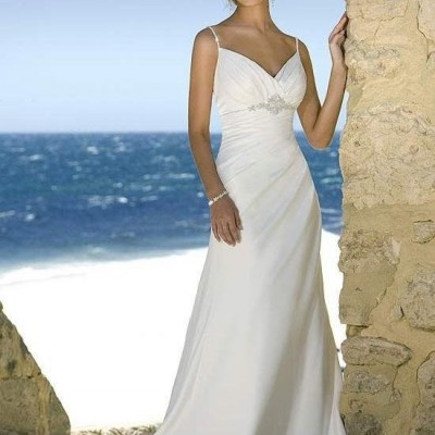 Beach wedding gown features in satin and drapes in a modified silhouettepicture1